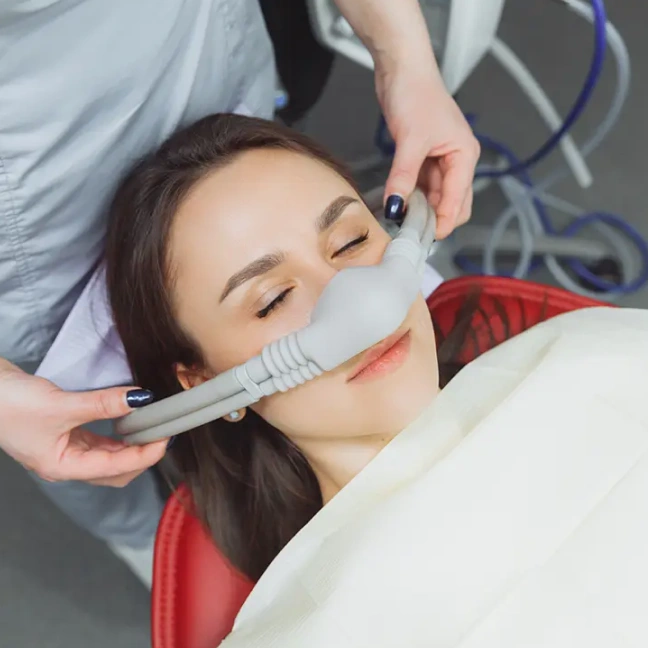 Patient comfortably receiving dental sedation