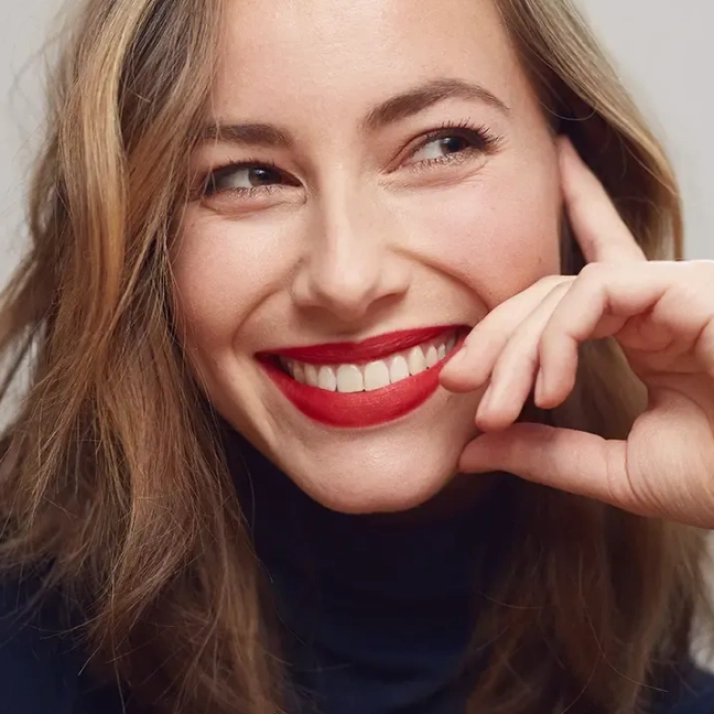Patient smiling with healthy teeth after dental care.